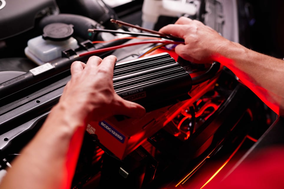 This Redarc BCDC1225D unit is being installed in a HiLux's engine bay. (image credit: Redarc)